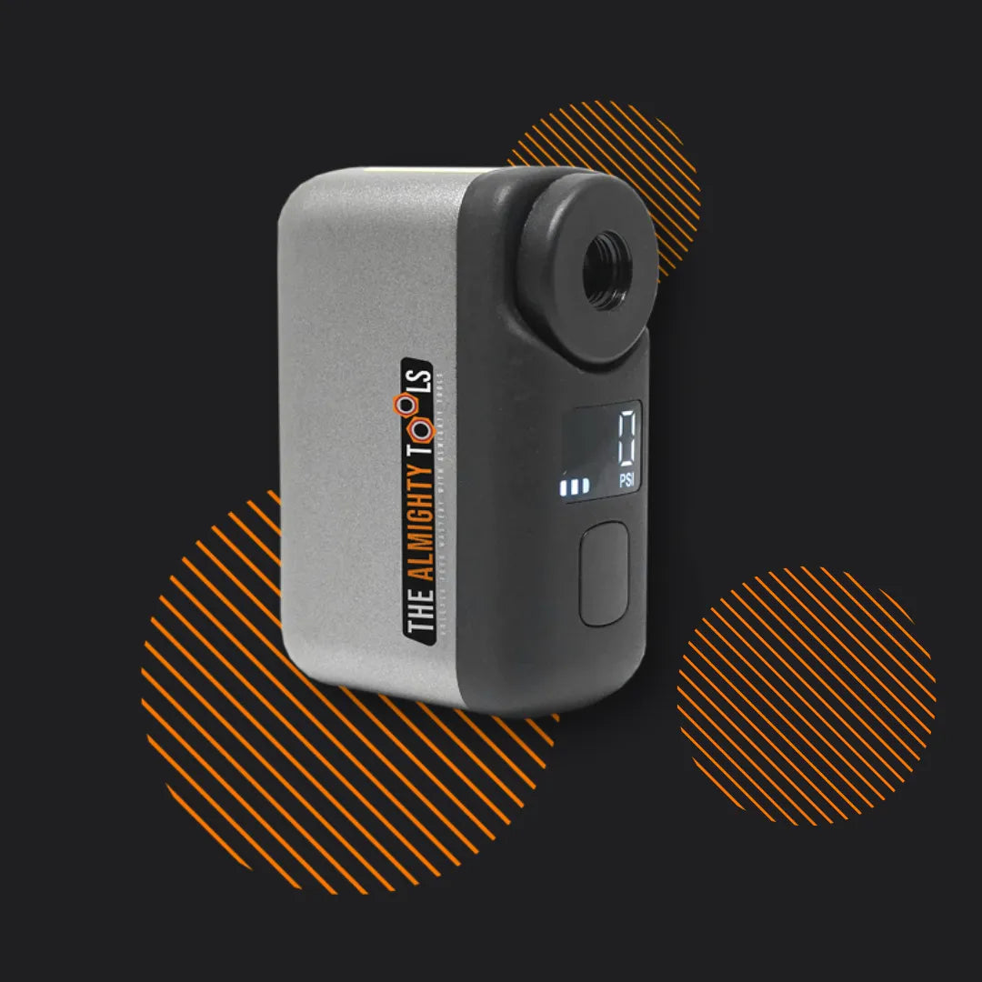 Portable AirBuddy air compressor with digital display by The Almighty Tools on black background