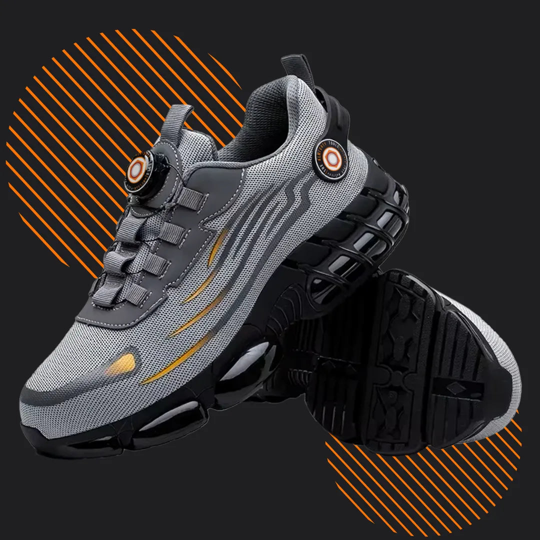 Gray athletic running shoes with orange accents on a black background with orange stripes