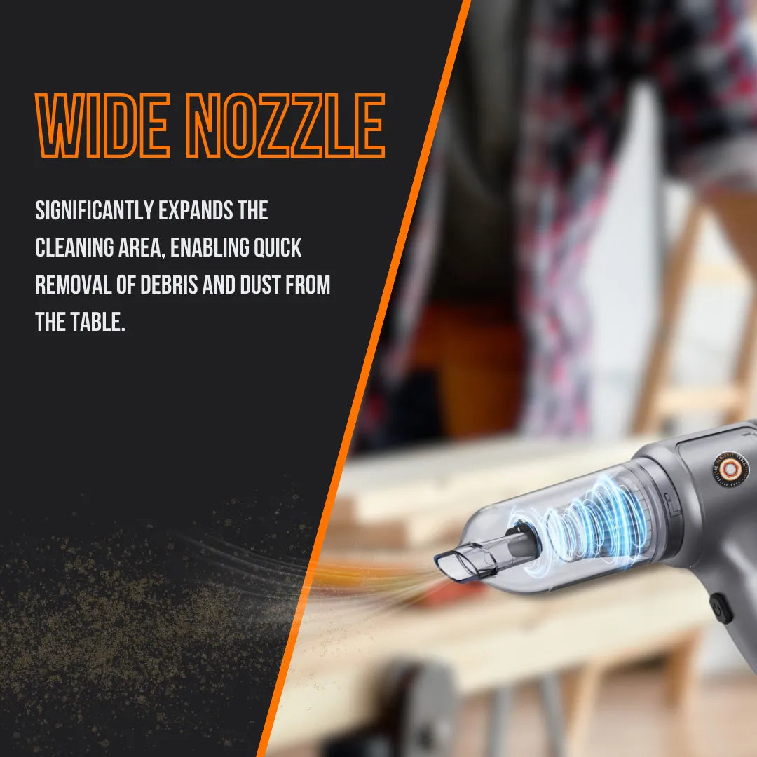 Handheld vacuum with wide nozzle cleaning dust on workbench, modern cordless design.