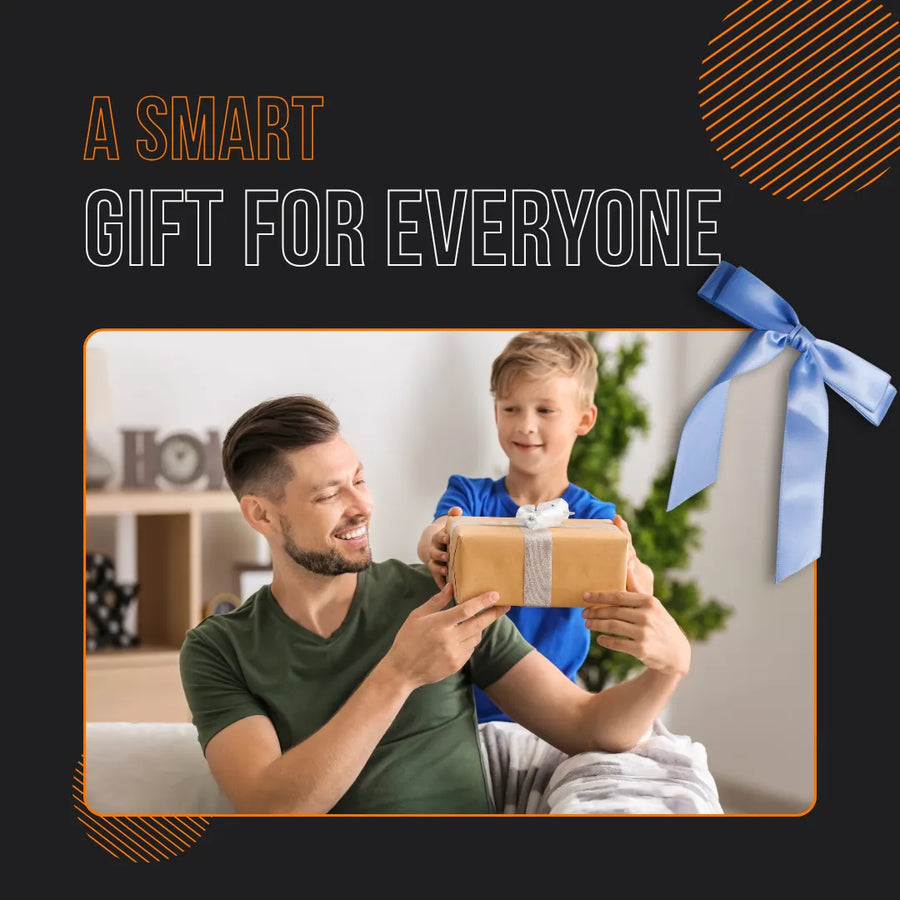 Smiling boy giving wrapped gift box to happy man, with text 'A Smart Gift For Everyone'.
