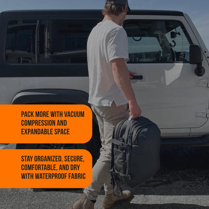 Man holding waterproof travel backpack by SUV, promoting vacuum compression and expandable space.