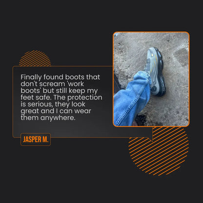 Person wearing rugged black and grey work boots with jeans on rough concrete surface