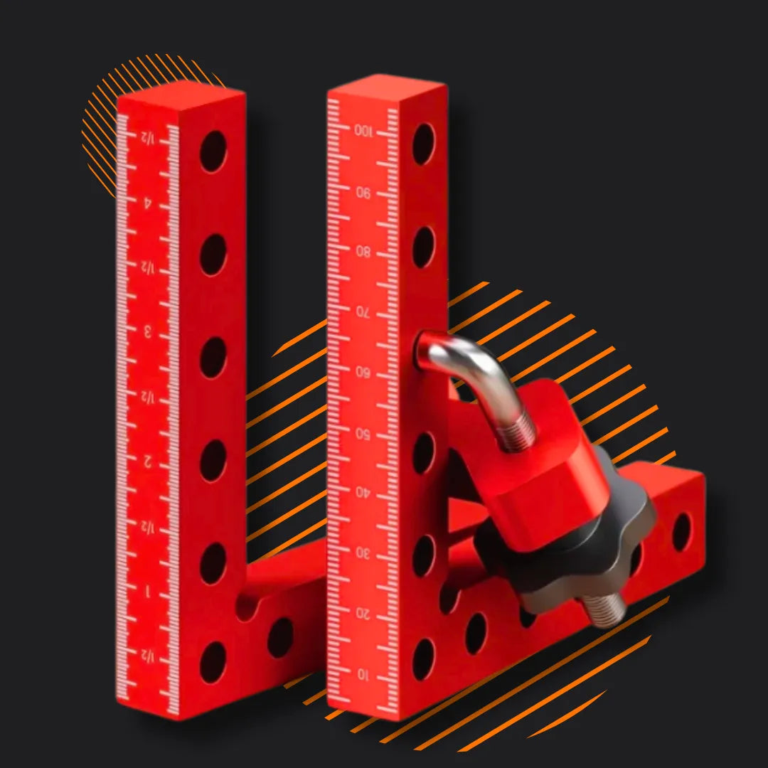Red aluminum clamping tool with ruler markings and holes on dark background