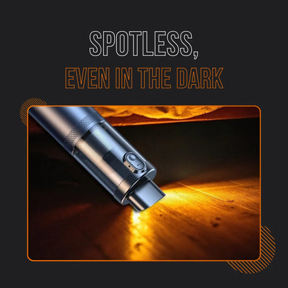 Cordless handheld vacuum cleaner with LED light cleaning under furniture on wooden floor