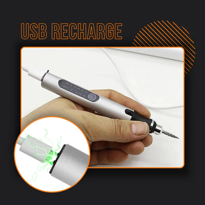 Hand holding a USB rechargeable electric engraver pen with charging indicator