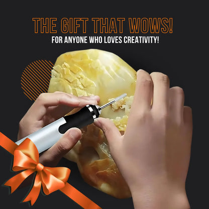 Hands using electric engraver tool on stone with creative gift text and orange ribbon