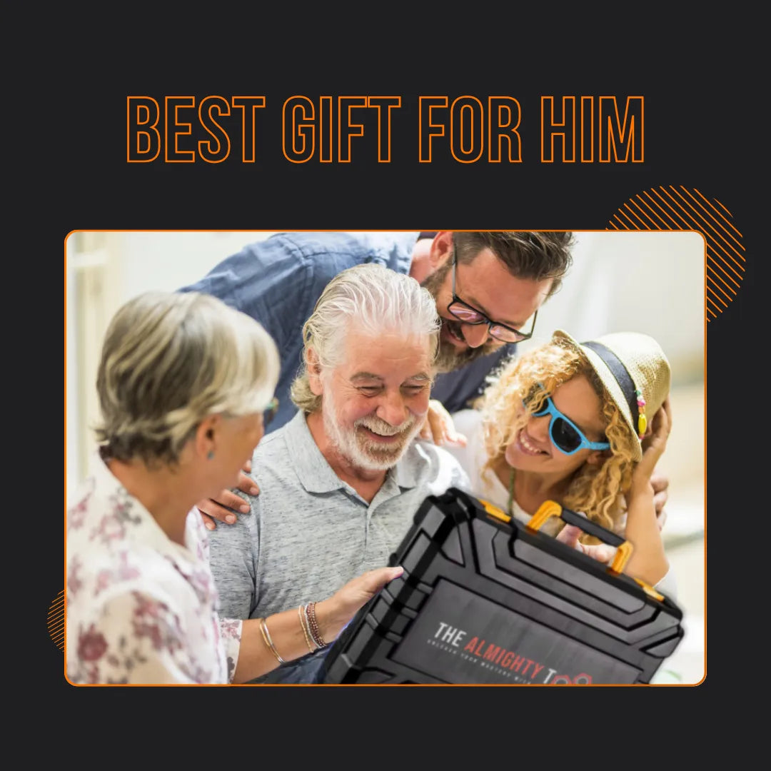 Family giving older man 'The Almighty Fixer' tool kit gift, smiling together indoors
