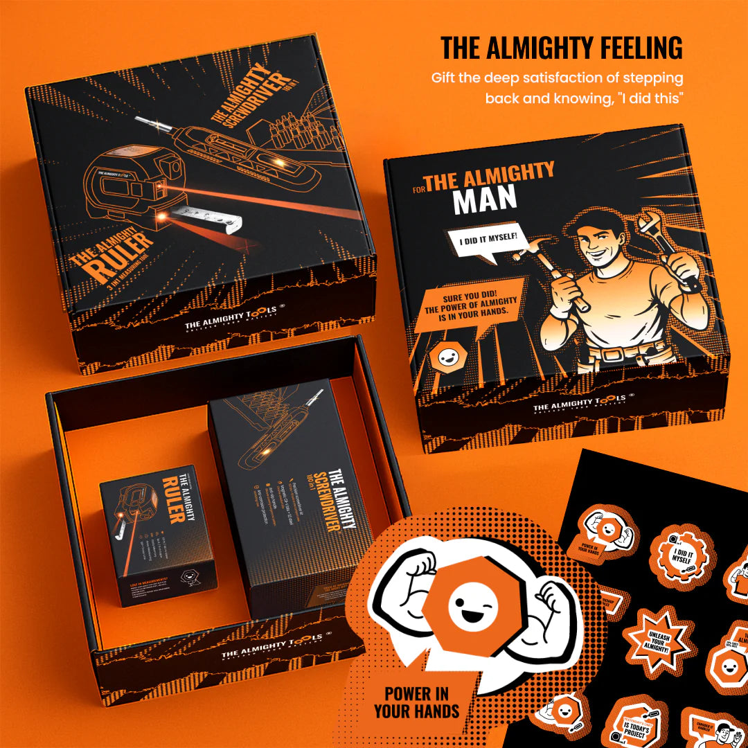 The Almighty Gift Box tool set with screwdriver, ruler, vibrant orange packaging, and stickers