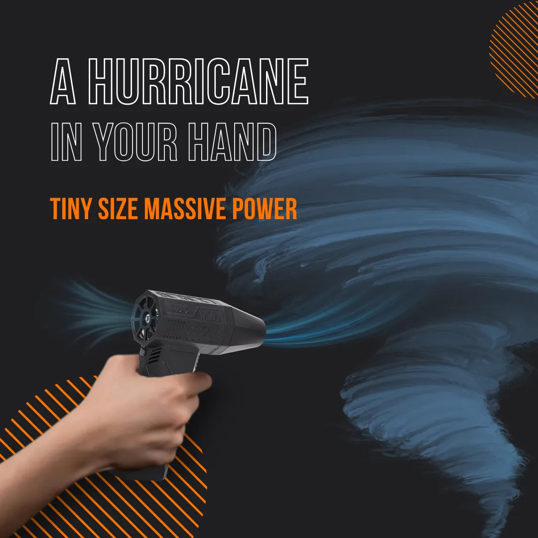 Hand holding compact black air blower with swirling blue wind, hurricane power concept