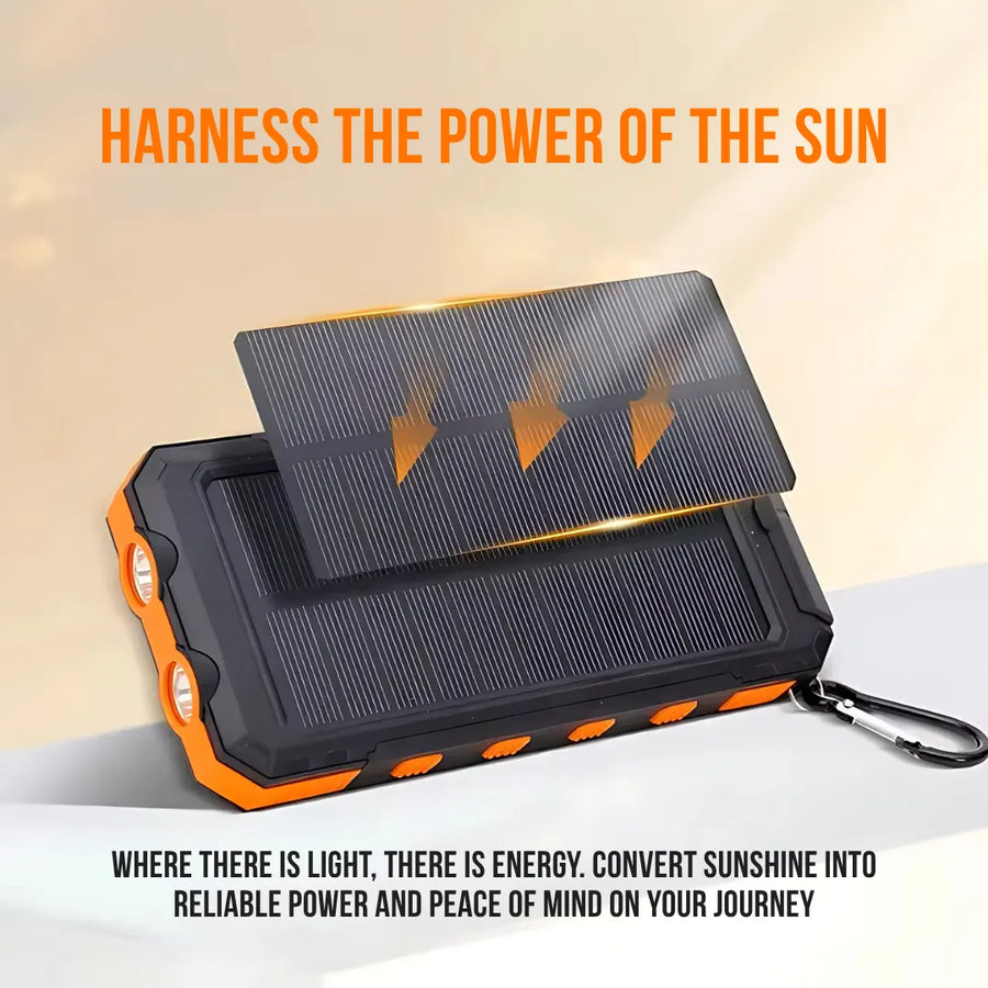 Portable solar power bank with orange accents and carabiner harnessing sunlight for charging