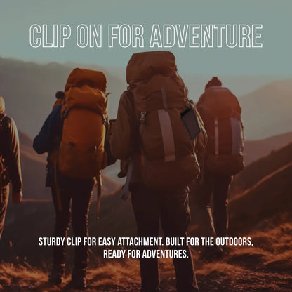 Hikers with backpacks using a clip-on power bank outdoors at sunset, ready for adventure.