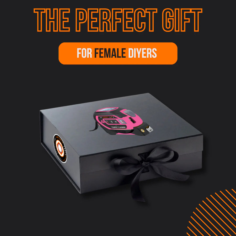 Gift box with pink tape measure, perfect tool gift for female DIYers, on black background