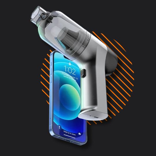 Silver handheld vacuum cleaner with a smartphone on black background and orange lines